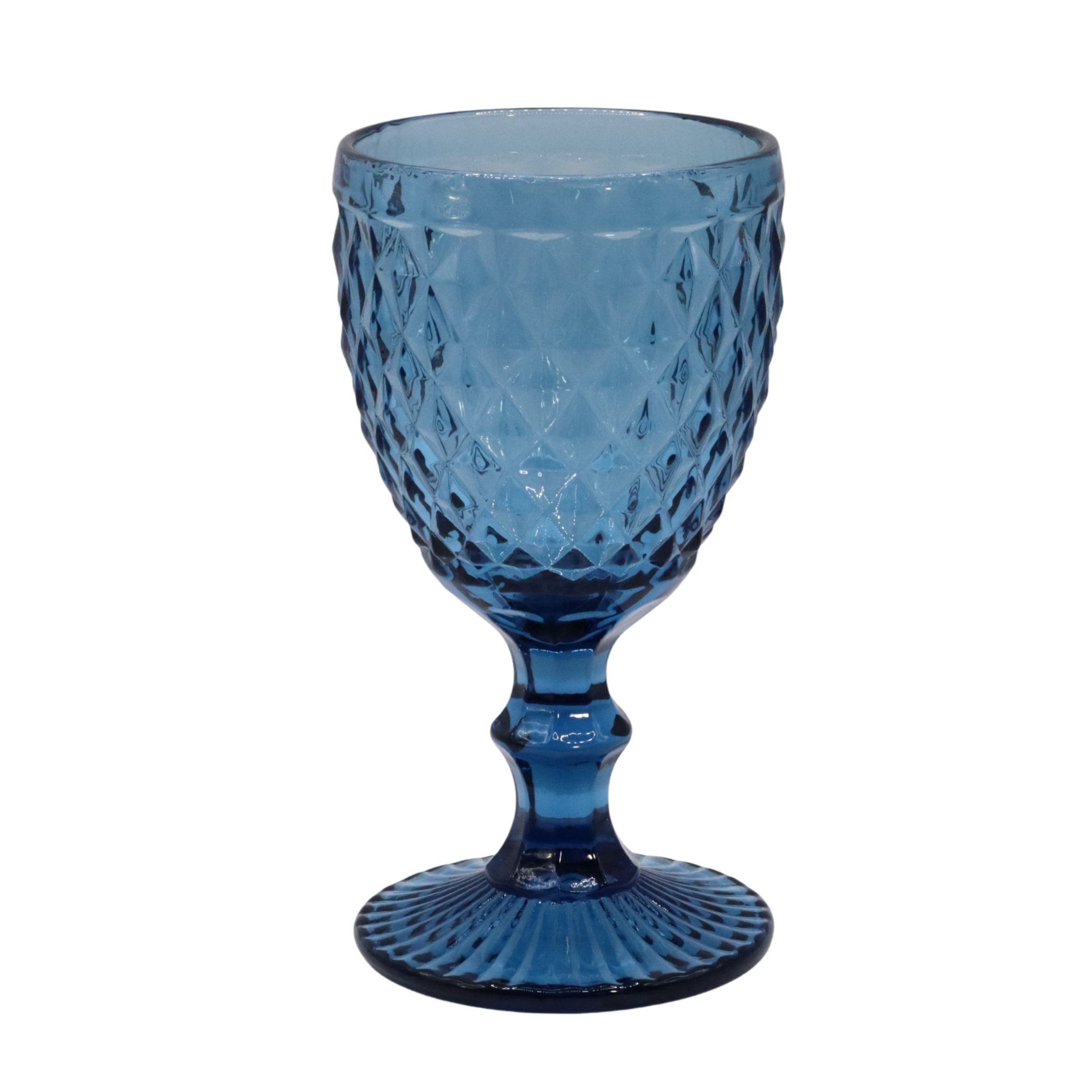 Blue glass goblet with textured design on a white background