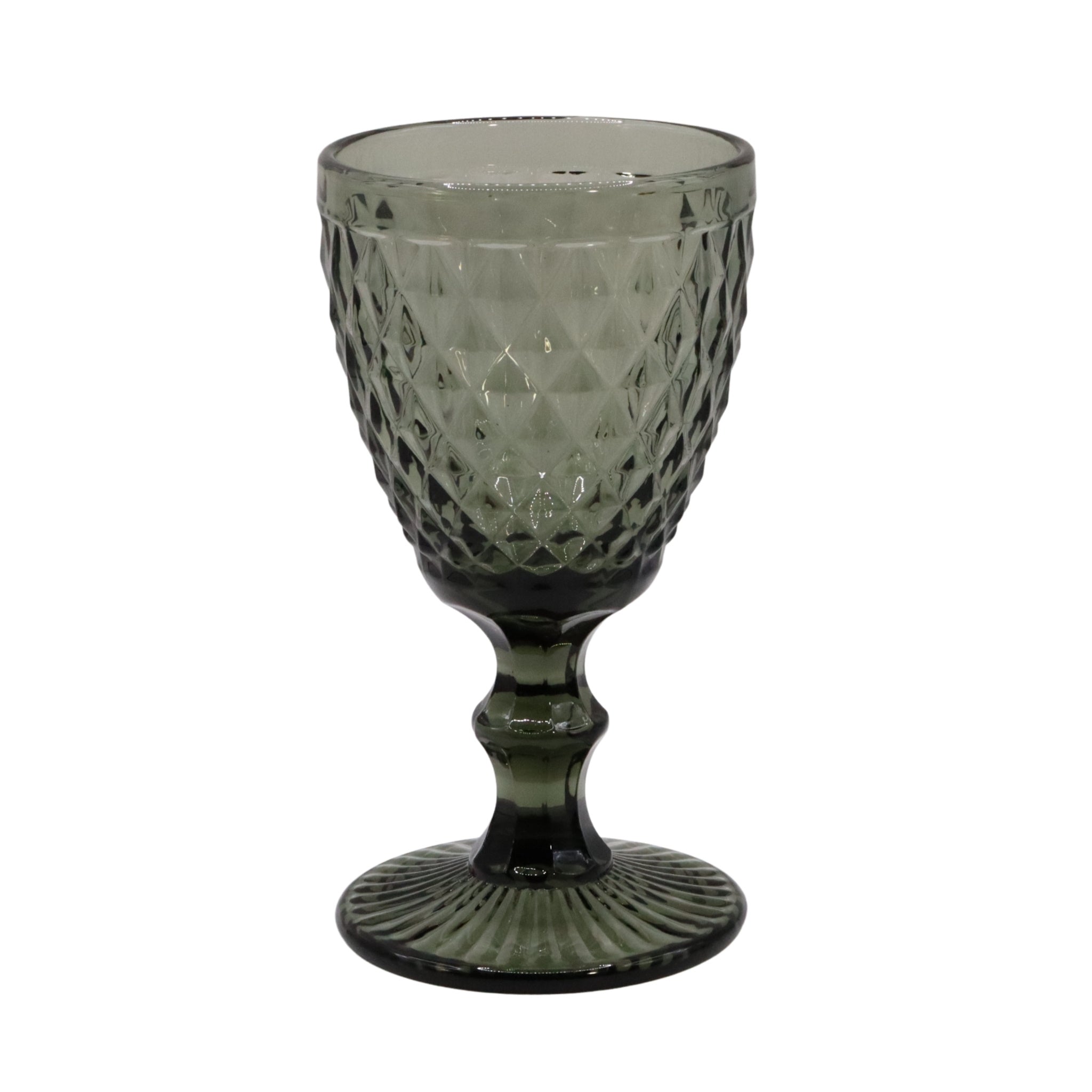 Green textured glass goblet on a white background