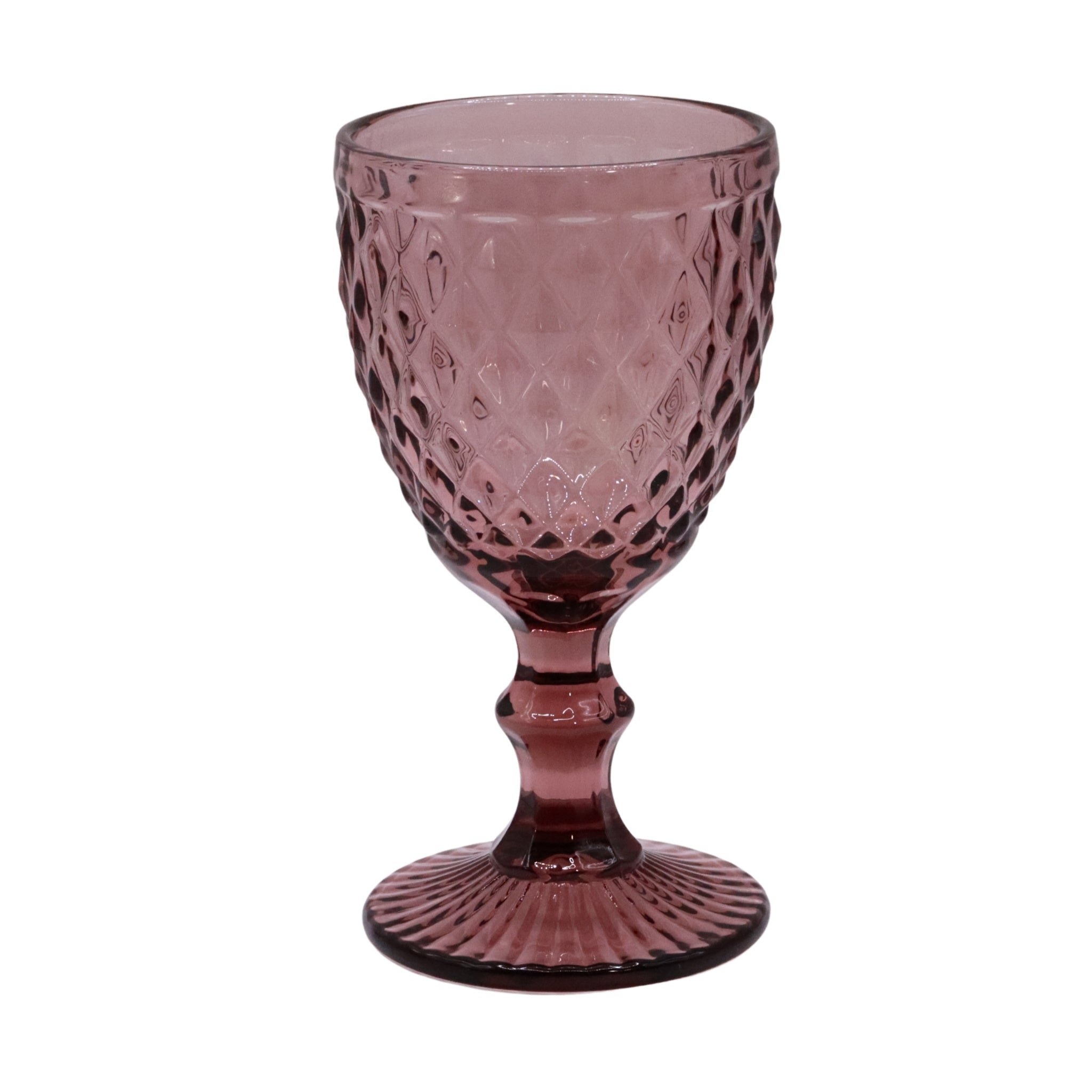 Pink glass goblet with textured design on a white background
