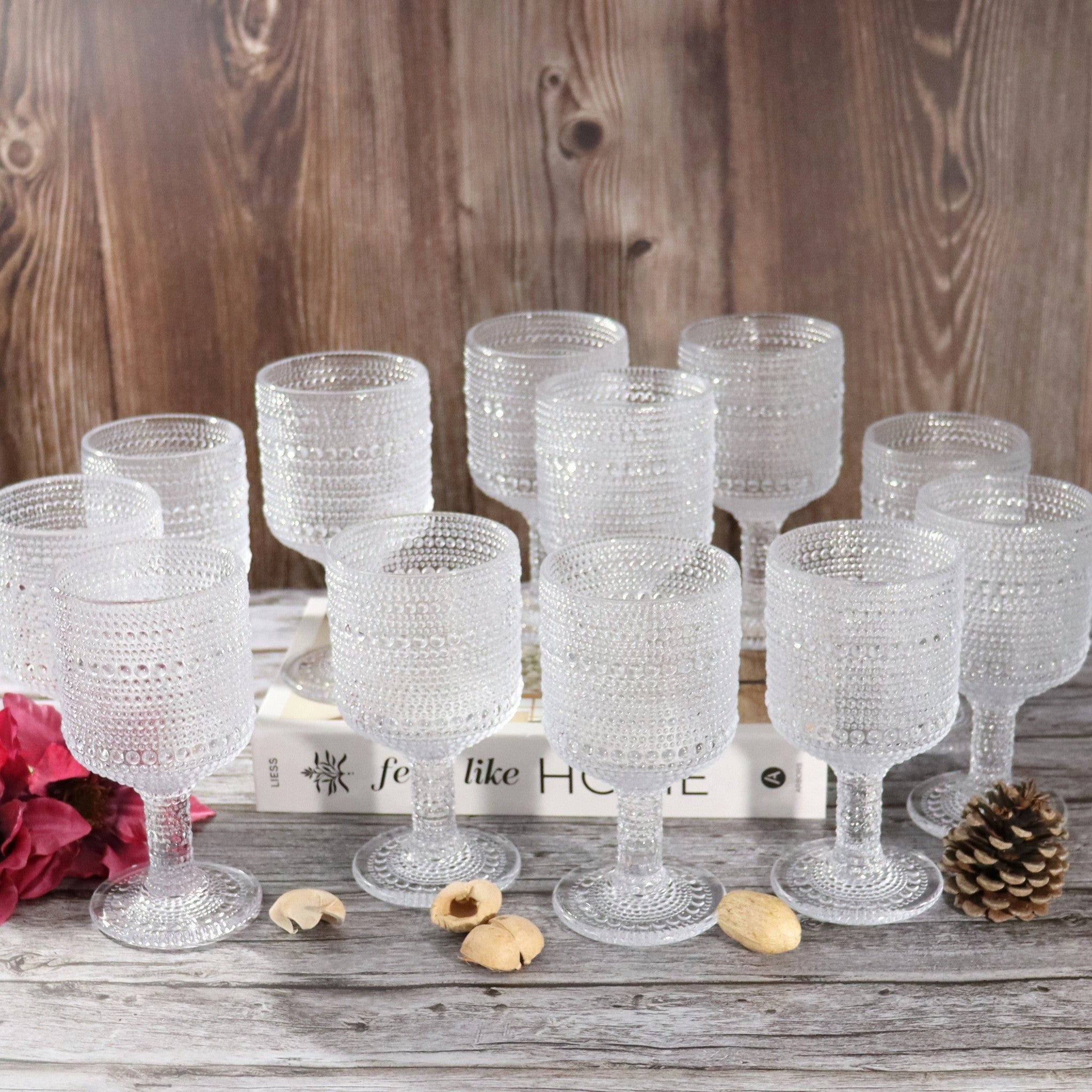 Set of textured glass goblets on a wooden surface with a rustic background