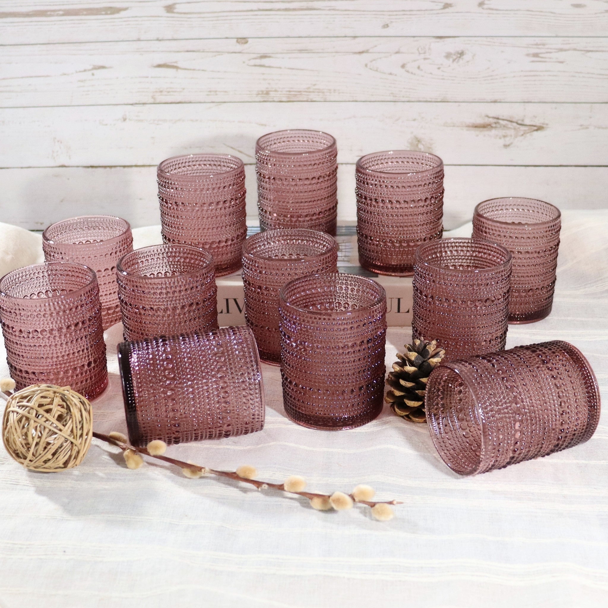 collection of purple hobnail textured glass tumblers