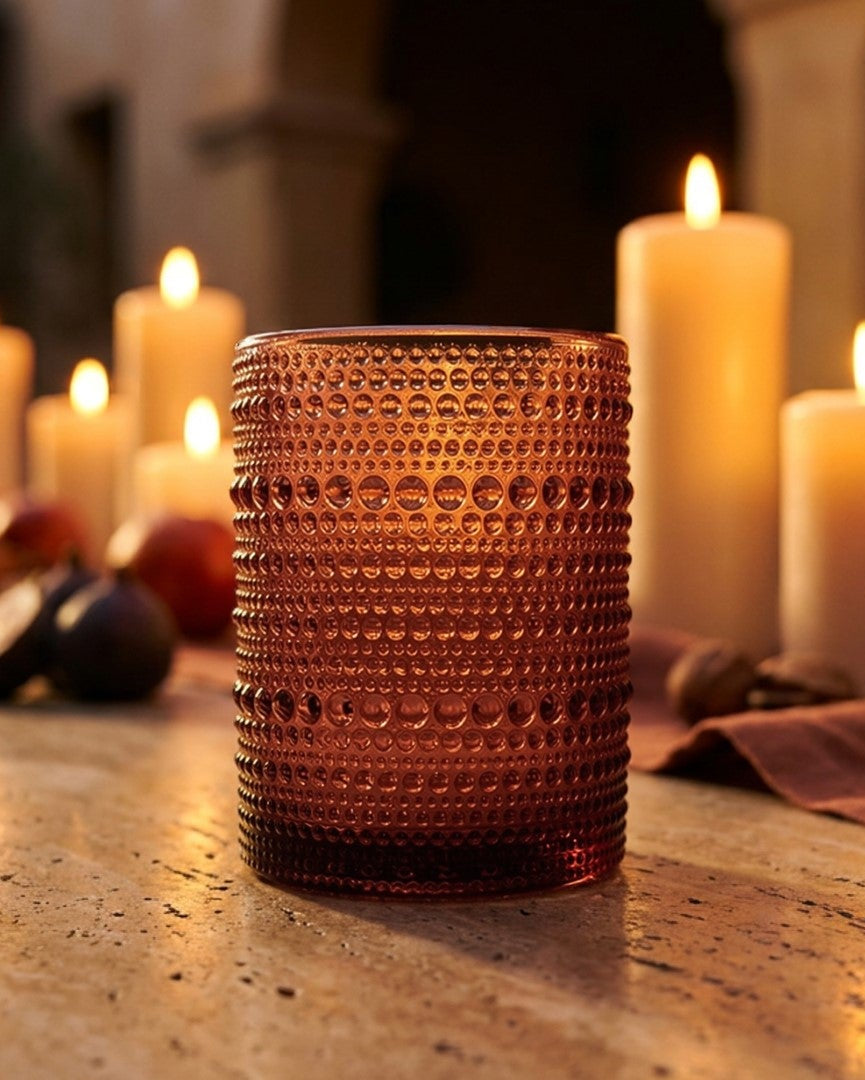 collection of purple hobnail textured glass tumblers
