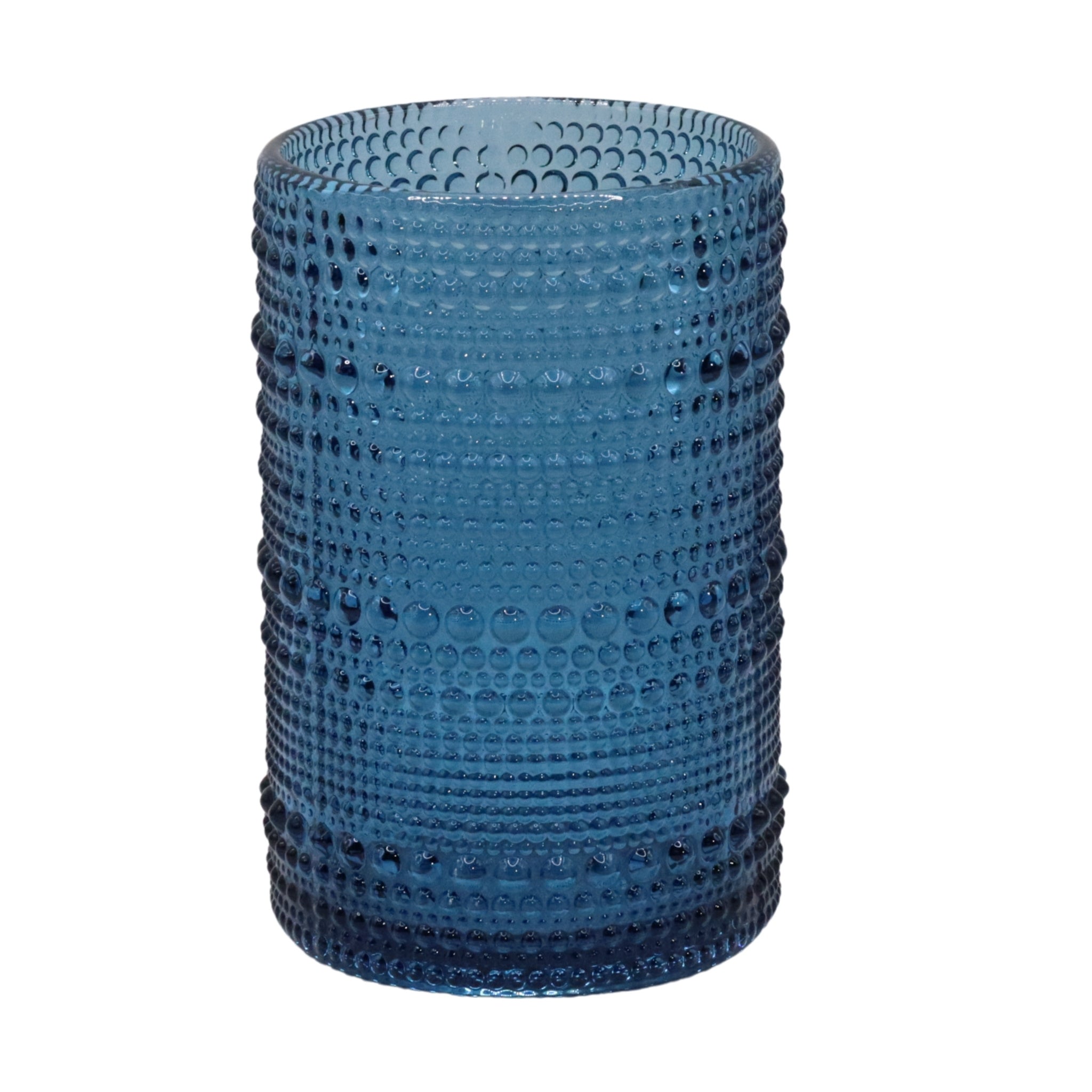 Blue hobnail glass vase on a white background
