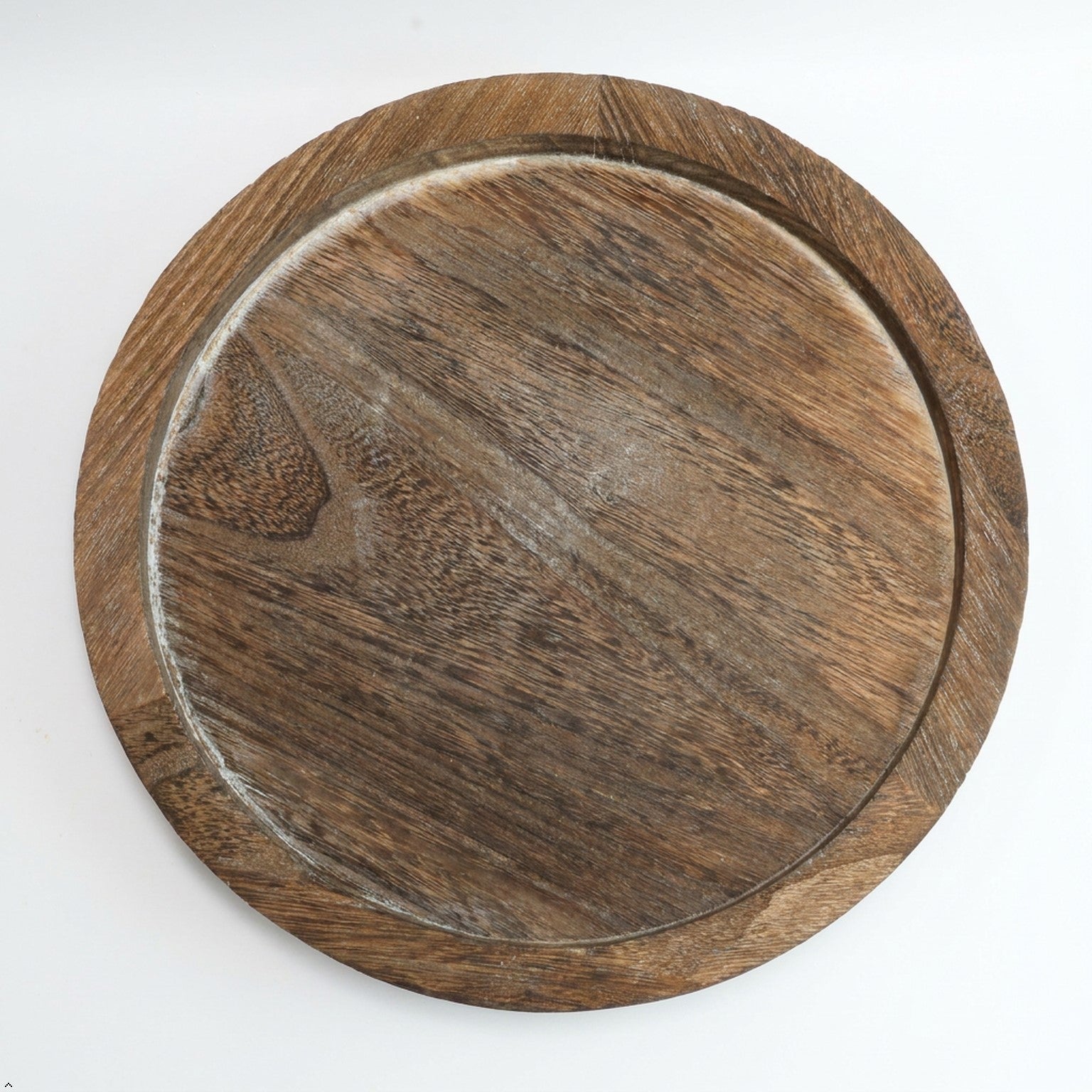 Round wooden tray on a white background