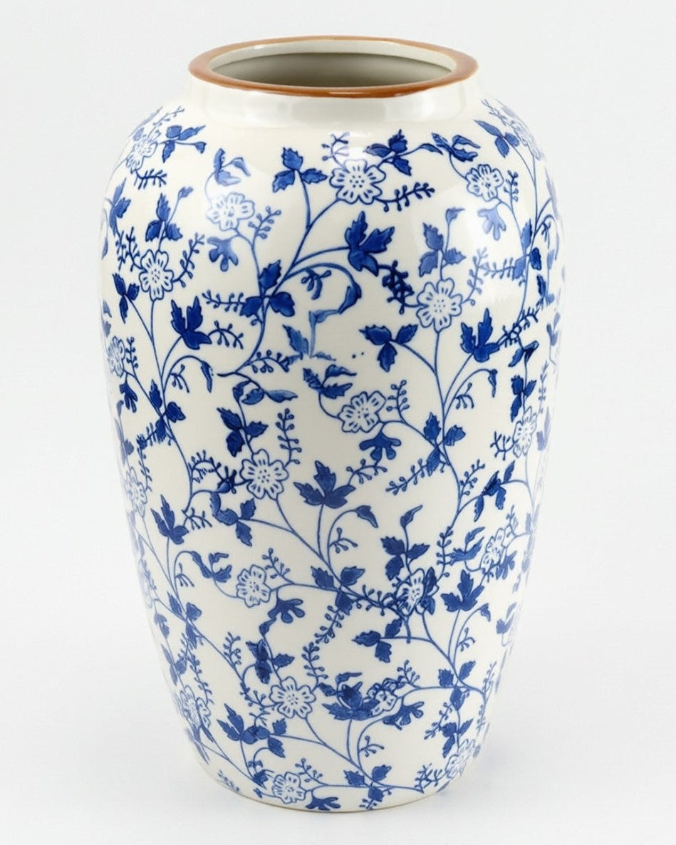 Ceramic vase with blue floral pattern on a white background