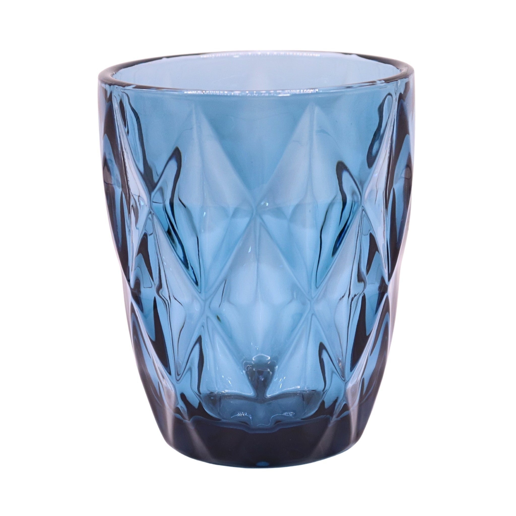Blue glass tumbler with textured design on a white background