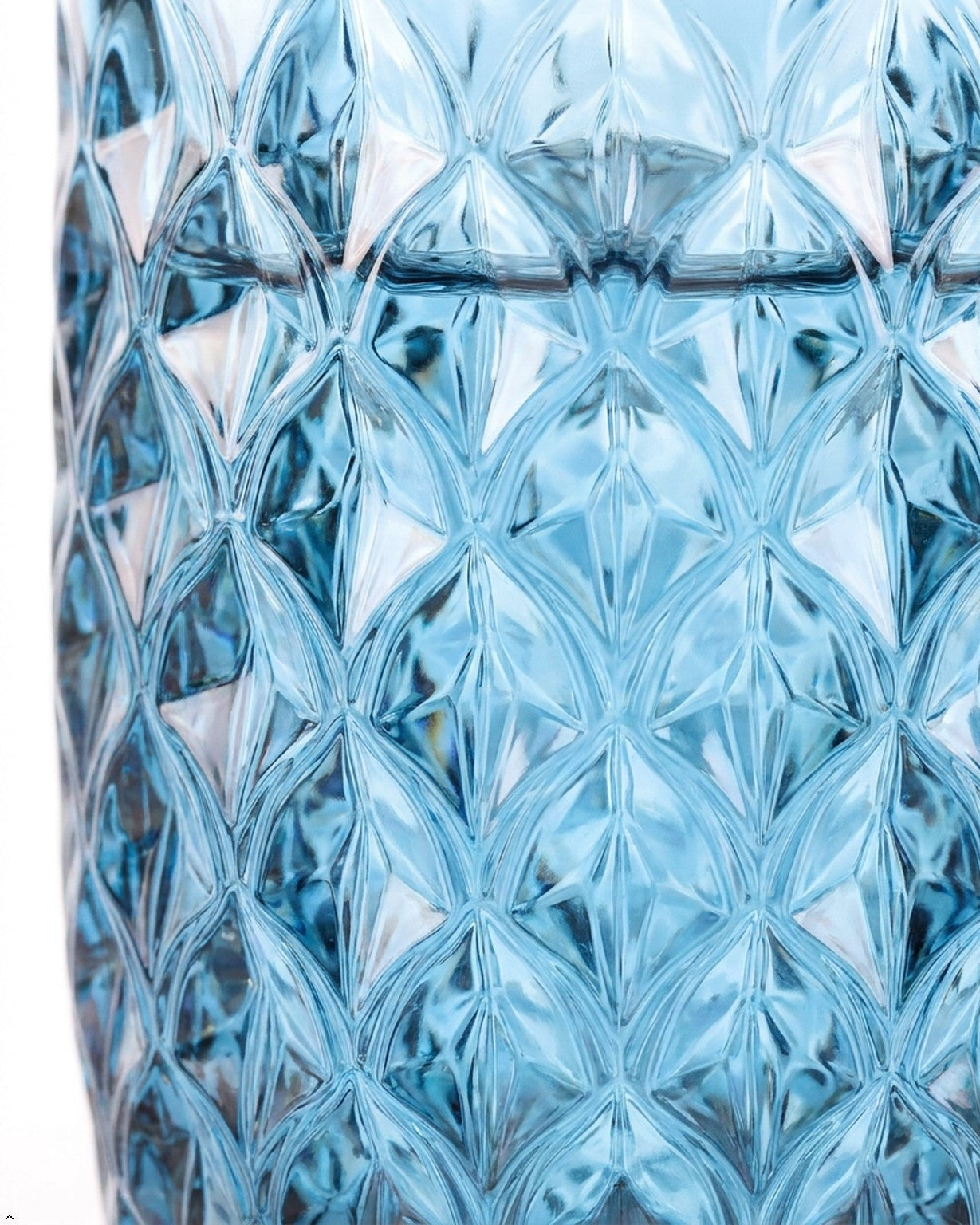 Set of blue textured glass tumblers on a wooden surface