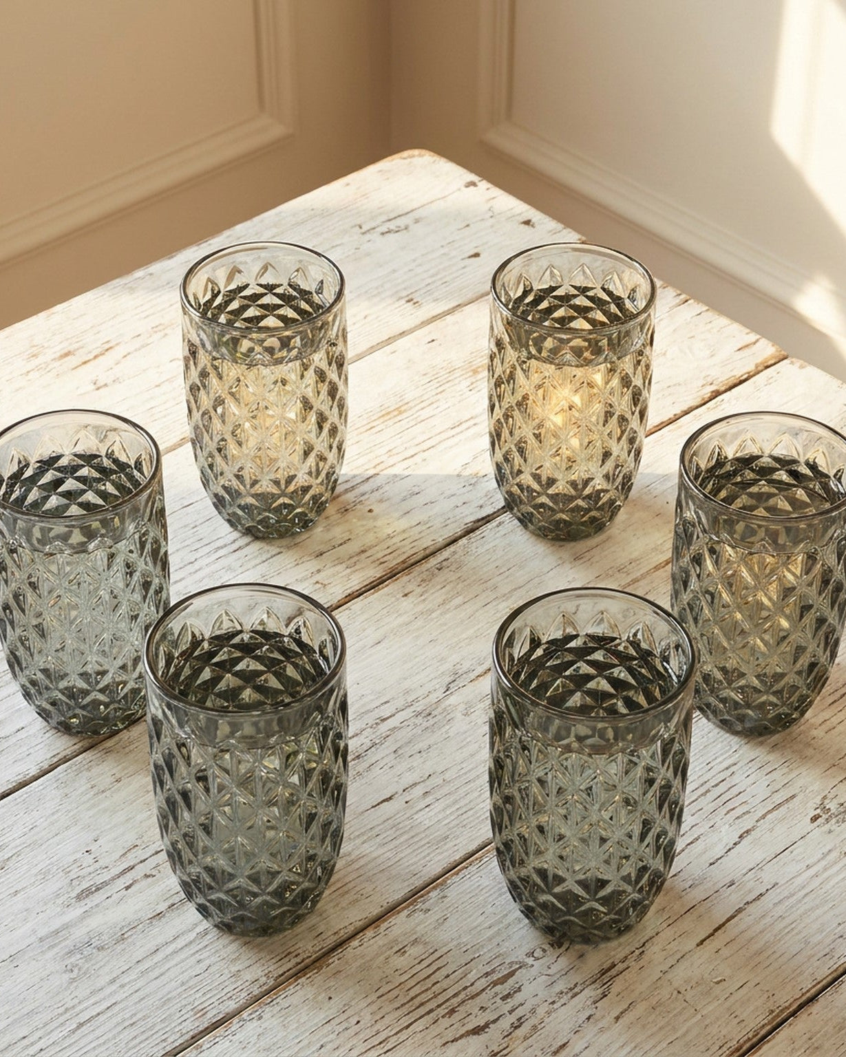 grey diamond facet glass on wooden surface