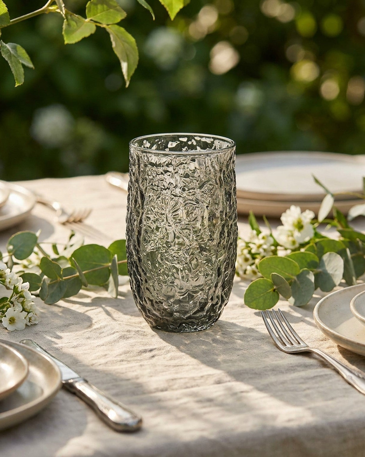 Textured glass tumbler on a wooden surface