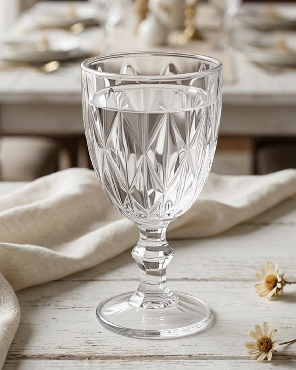 Clear glass with water on a wooden table in a dining room setting