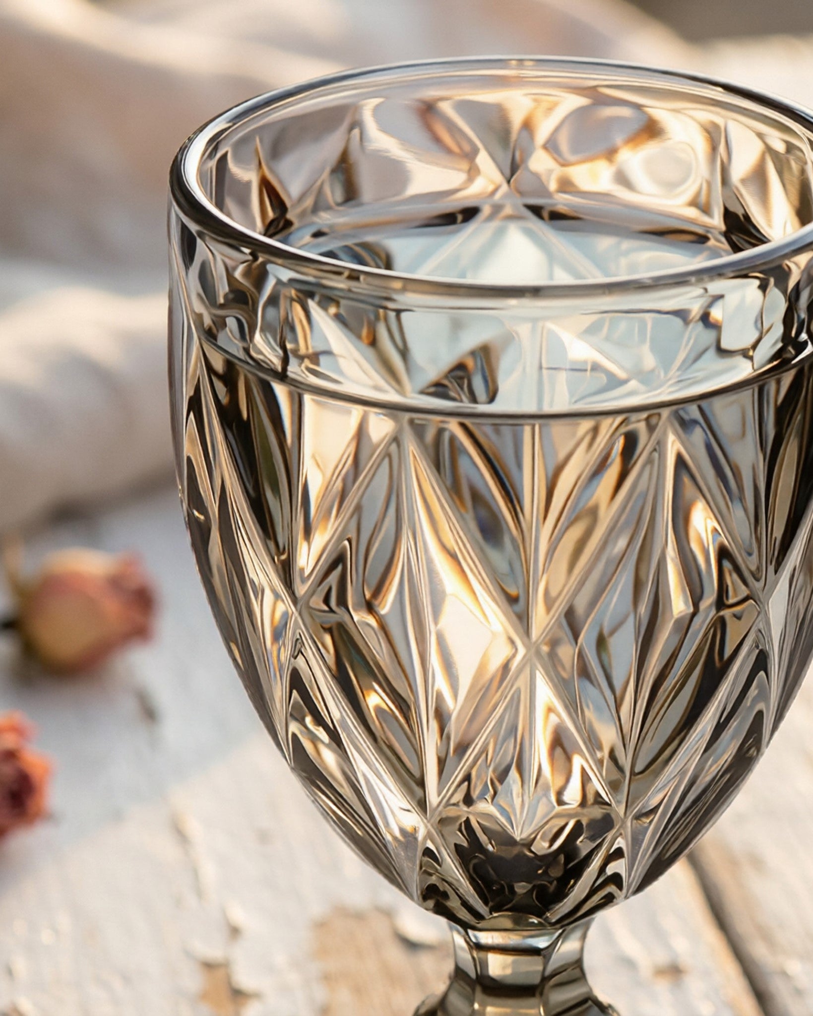 Decorative glass goblet with intricate patterns on a soft background