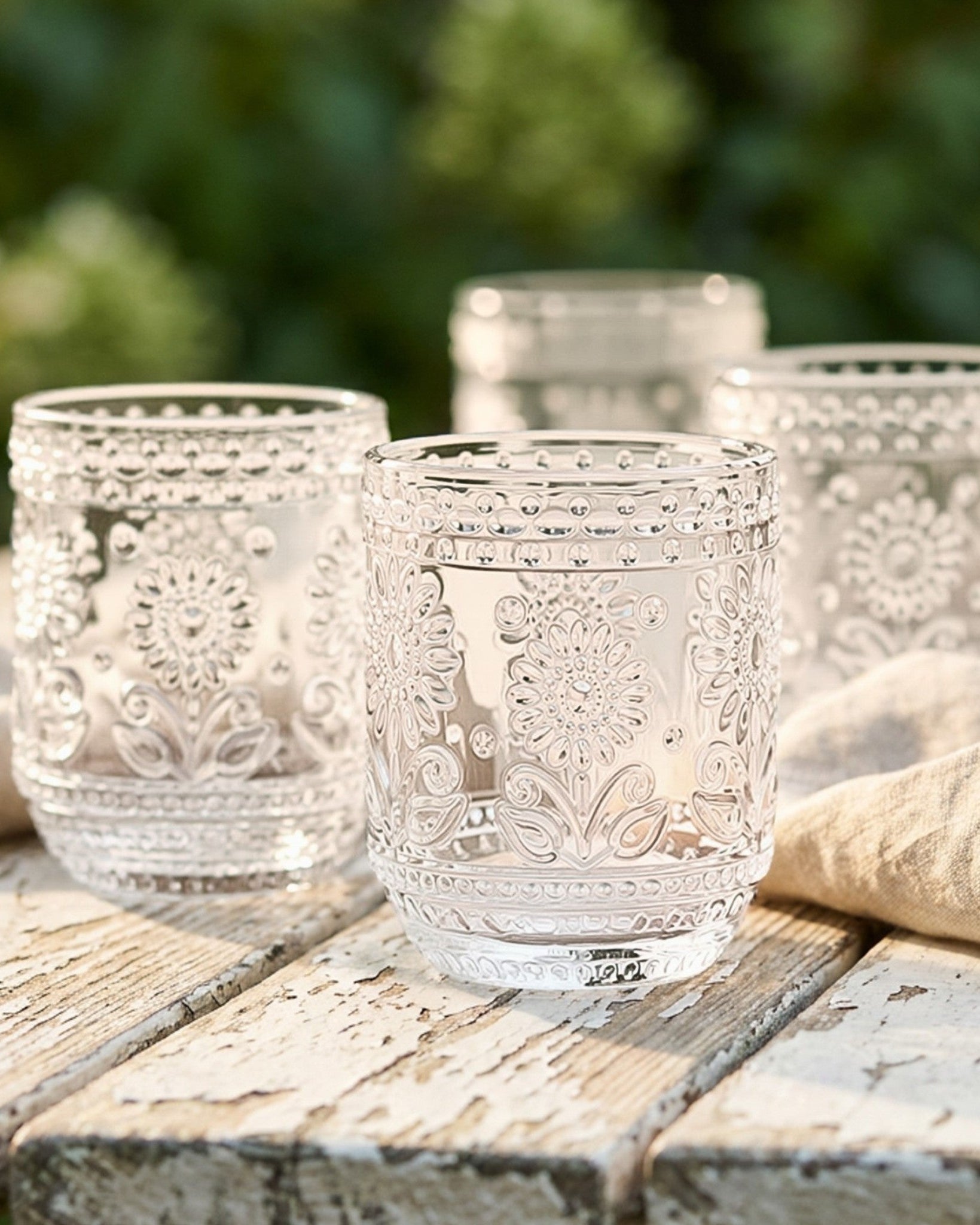 Clear glass with floral patterns on a white background