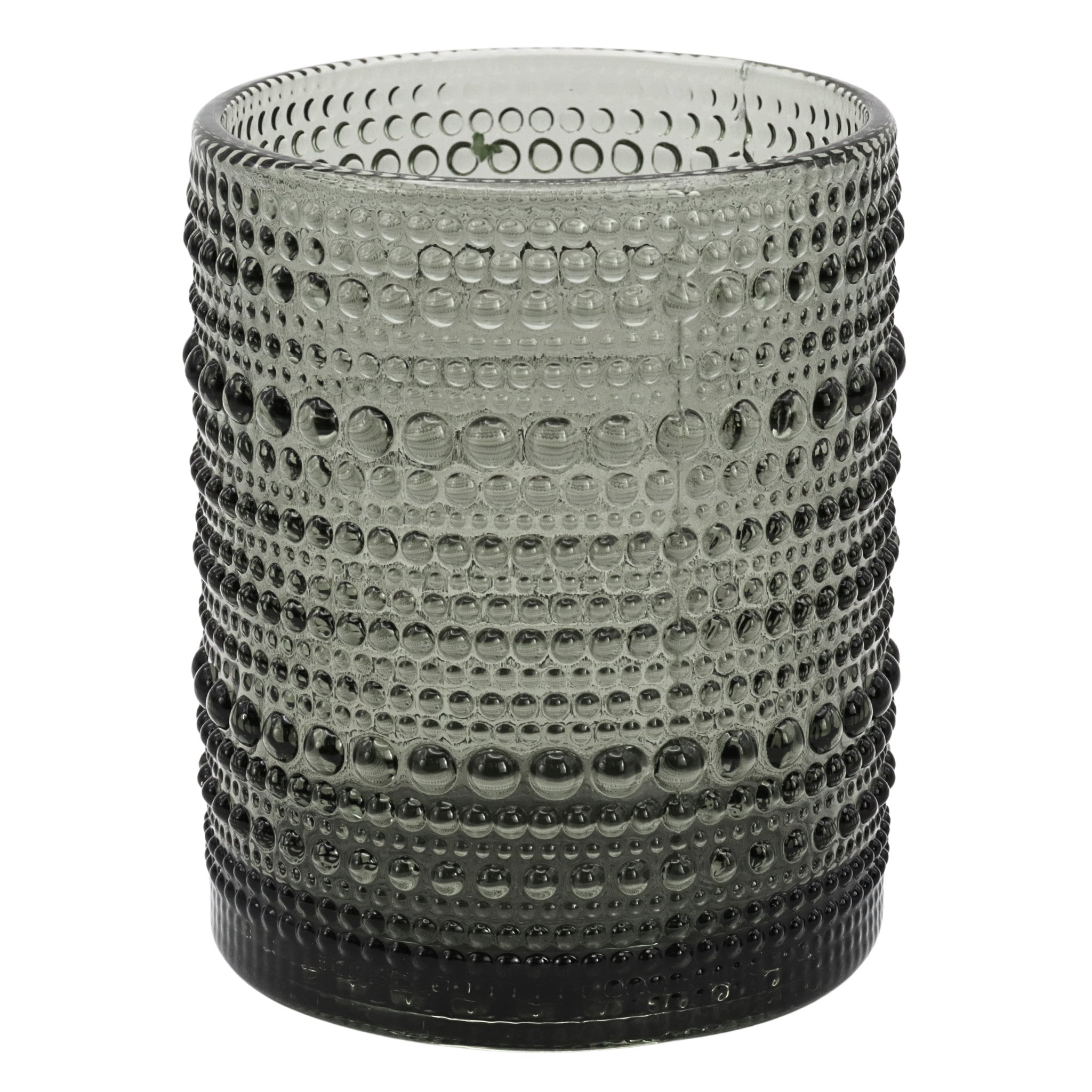 Textured small glass tumbler on a white background
