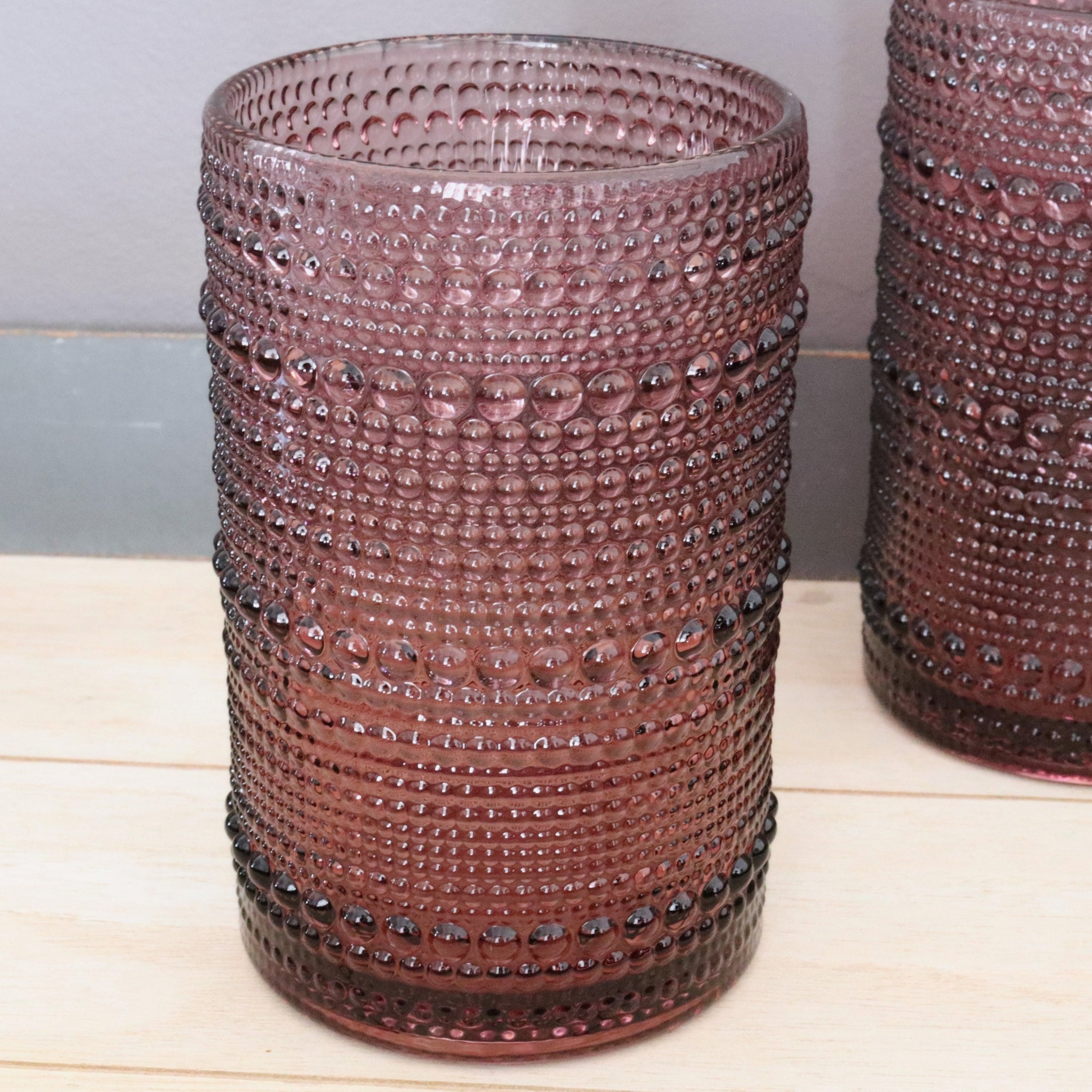 hobnail hi-ball glass with bead-like texture on a wooden surface