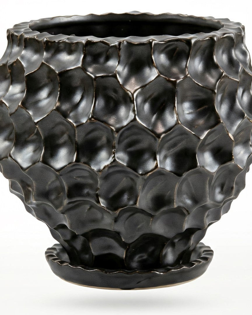 Black textured vase on a white background