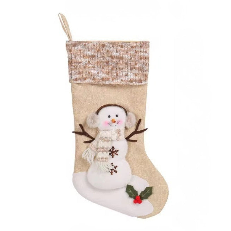 Christmas stocking with a snowman design on a white background