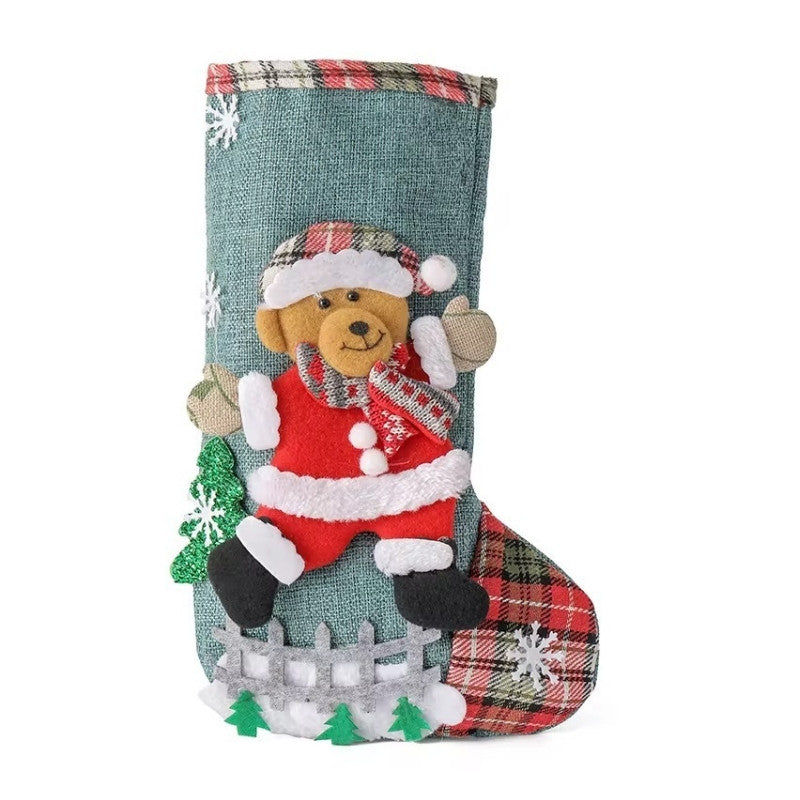 Christmas stocking with a teddy bear design on a white background