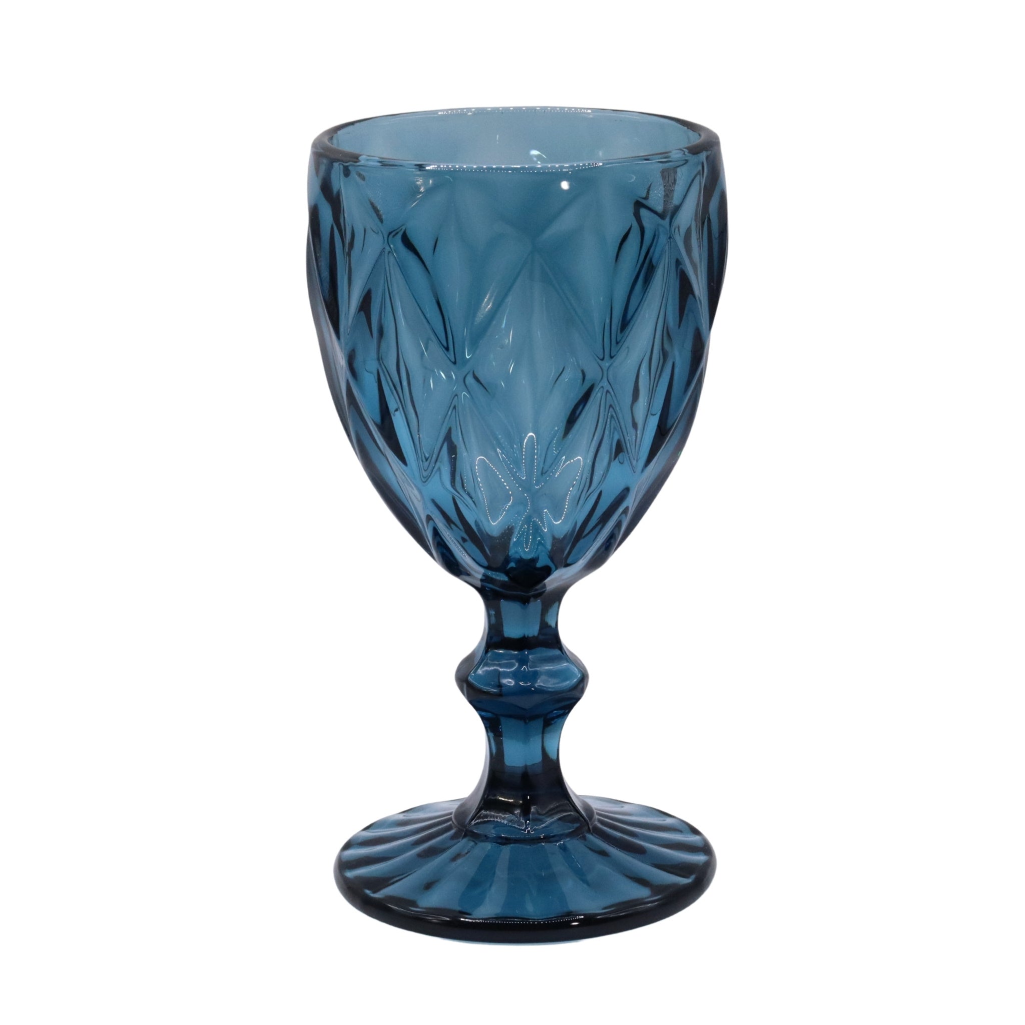 Blue glass goblet with intricate patterns on a white background