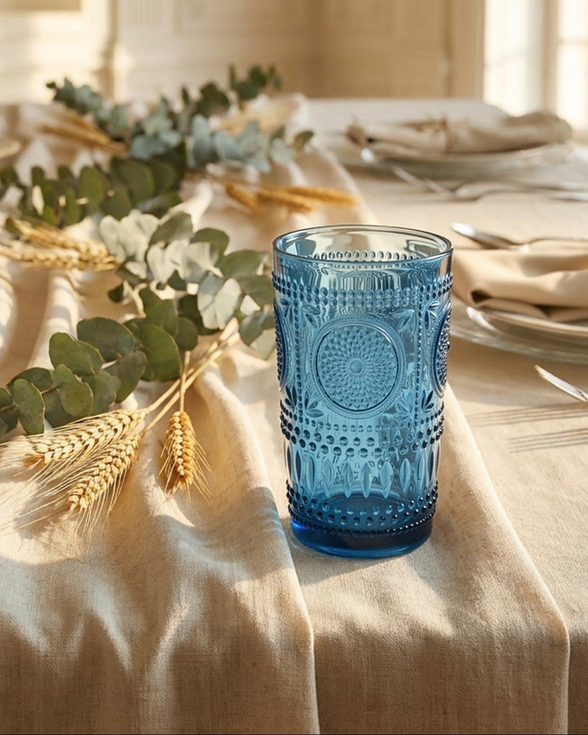 Set of blue textured glasses on a light background