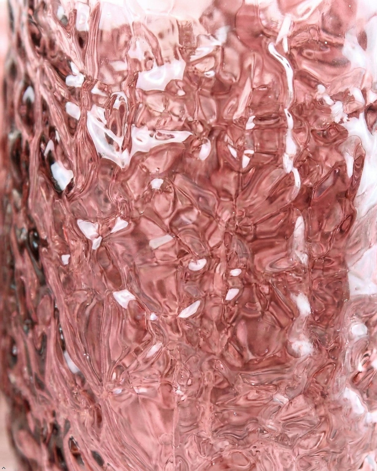 Close-up of a textured pink surface with a floral pattern